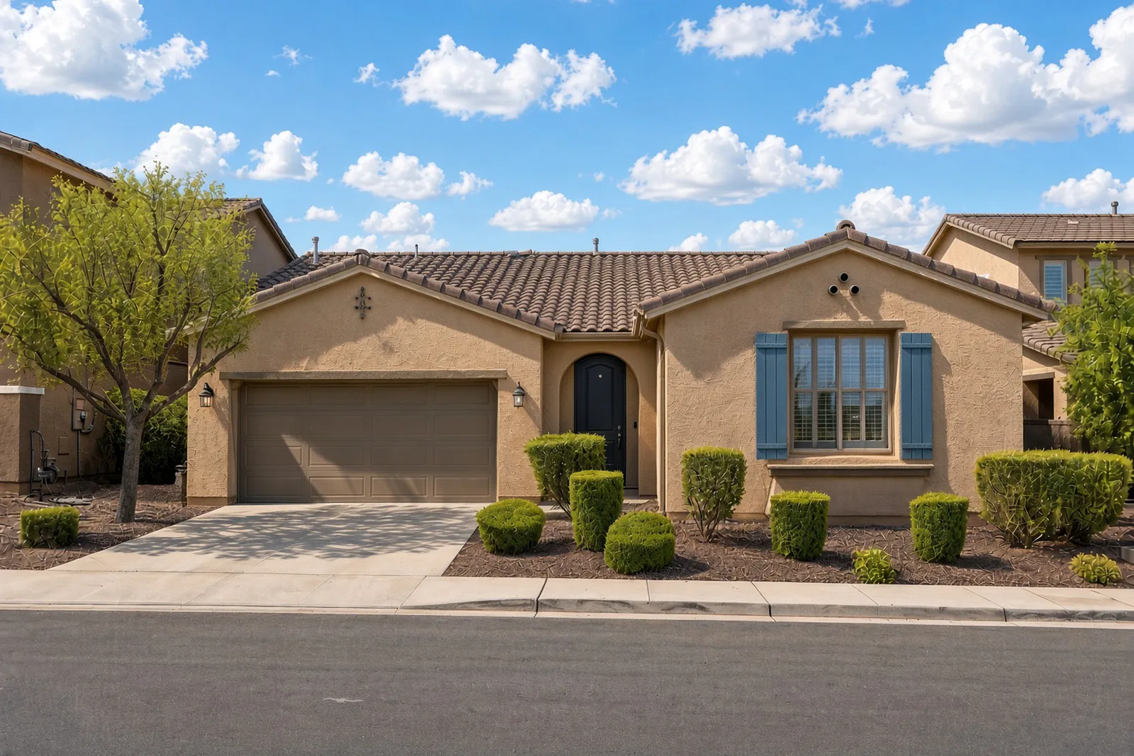 A single-story Las Vegas home in daylight with the lighting switched off